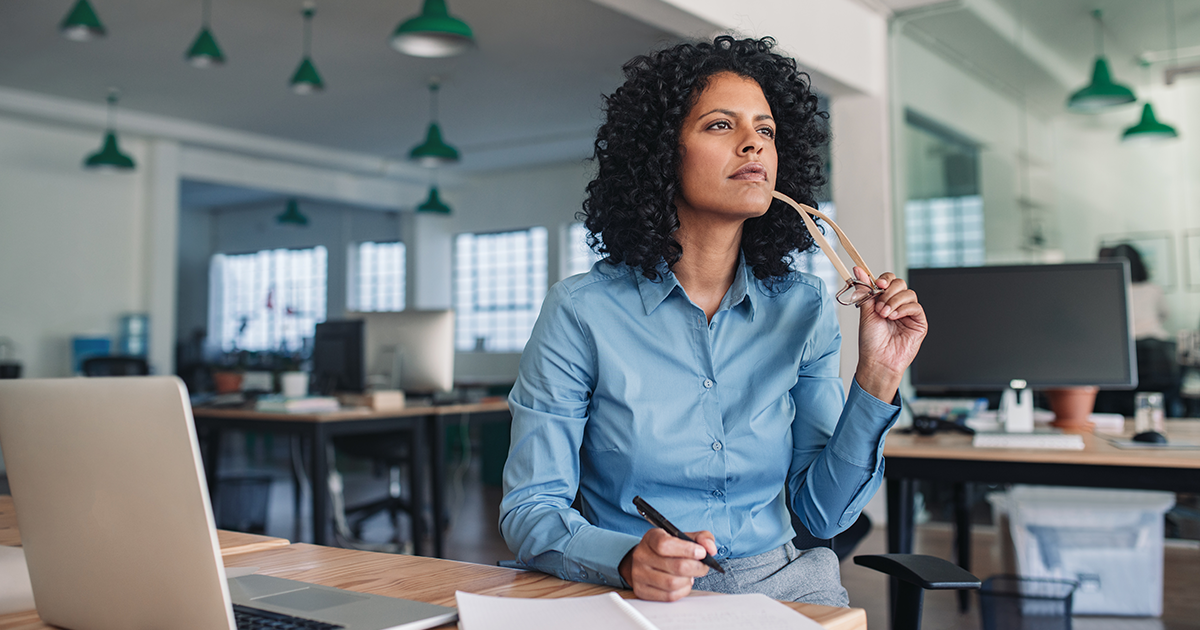 Woman thinking about office technology choices
