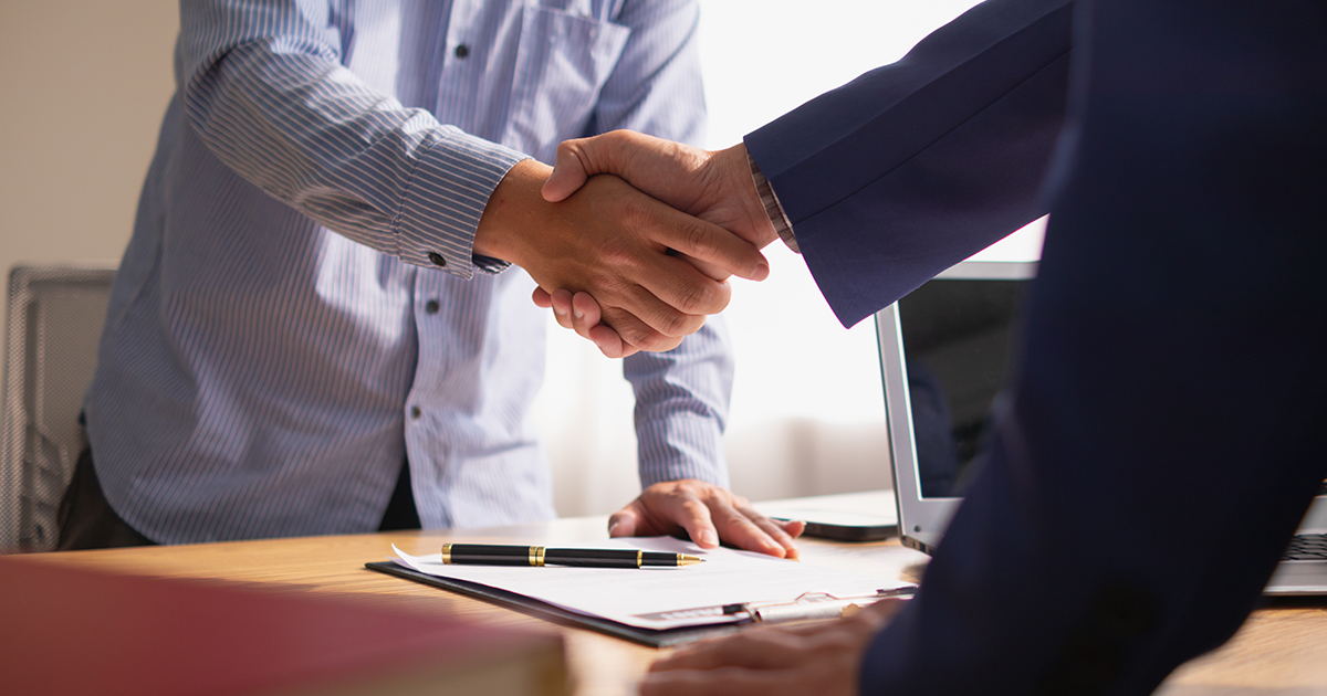 two businessmen shaking hands