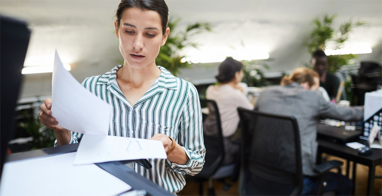 woman working at an office scanning documents